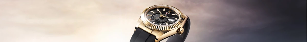 Rolex Sky-Dweller with a yellow gold case and bright black dial