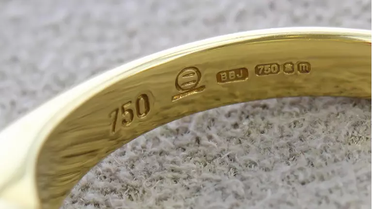 An example of a hallmark on a yellow gold ring