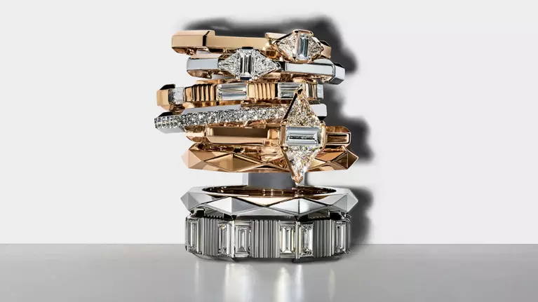 Stack of Gucci Link to Love rings in various colours of gold and set with diamonds