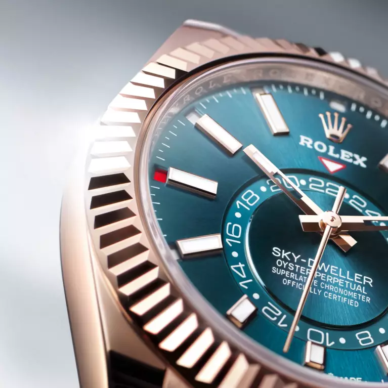 The Rolex Sky-Dweller with an Everose gold case and a blue-green dial