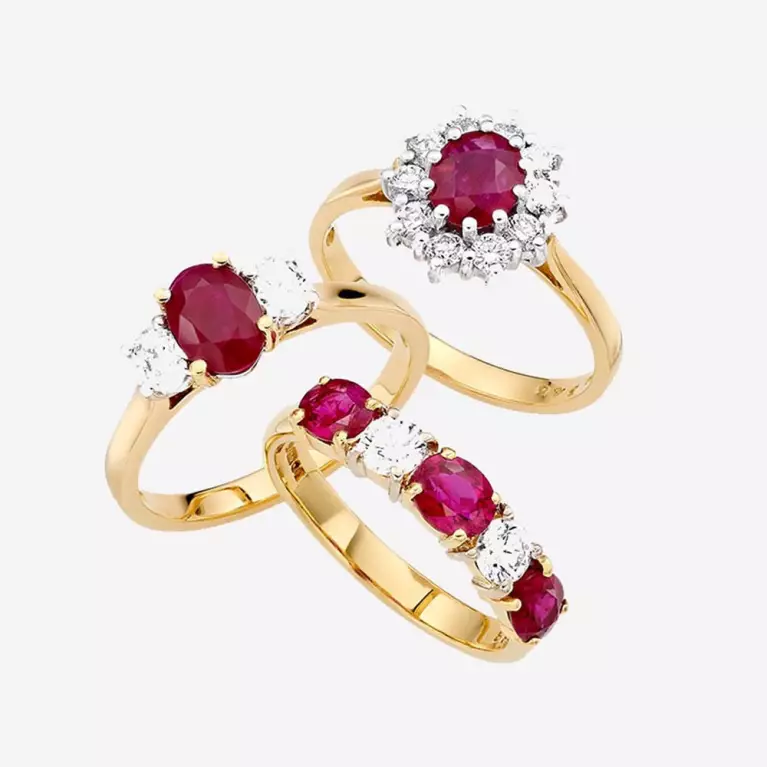 Three ruby and diamond rings in different styles