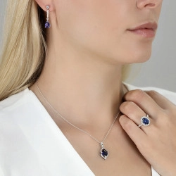 Platinum 2.30ct Sapphire & Diamond Halo Ring on models hand paired with matching necklace