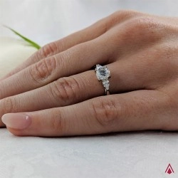 Florentine Platinum Brilliant and Pear Cut Diamond Three Stone Ring on hand close up