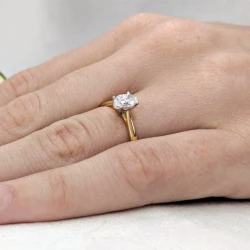 Classic Oval Yellow Gold Diamond Engagement Ring on hand