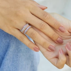 Different coloured stacking rings shown on a female hand