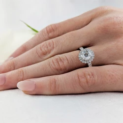 Skye Platinum and Brilliant Cut Diamond Cluster Ring on models hand close up