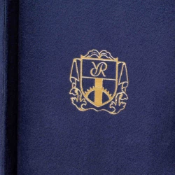 Rapport London Emblem in gold on blue suede inside the watch zip case lid
