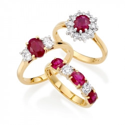 three ruby and diamond rings in yellow gold one cluster, one three stone and one five stone.