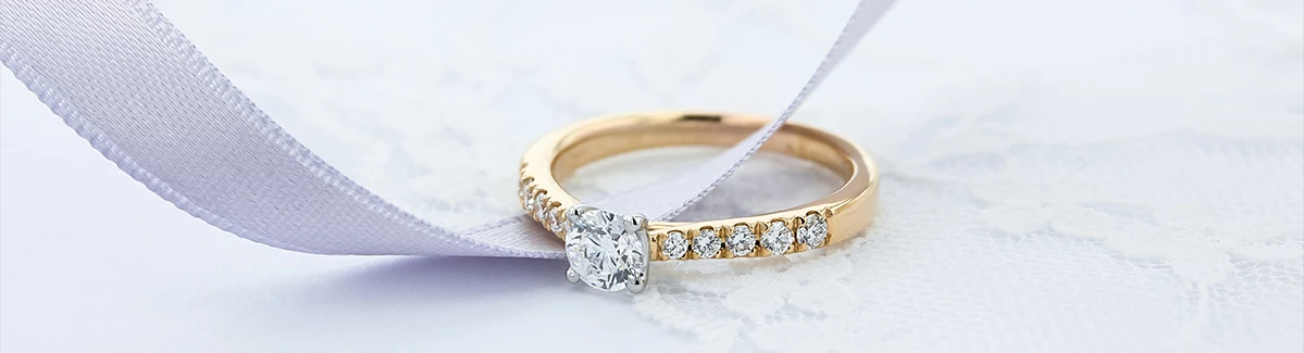 A yellow gold diamond engagement ring
