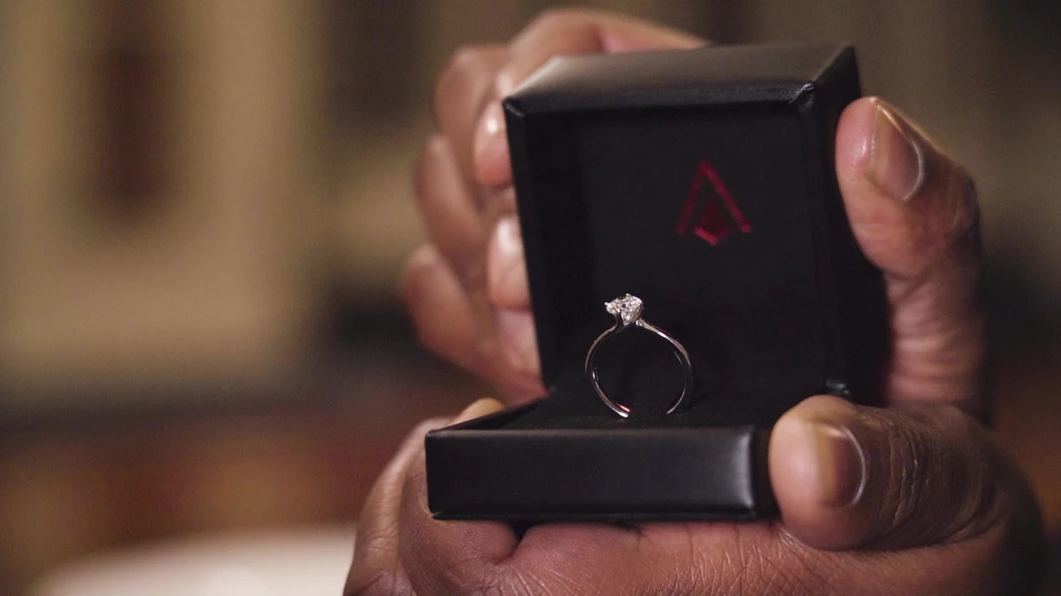 An engagement ring in a Baker Brothers ring box