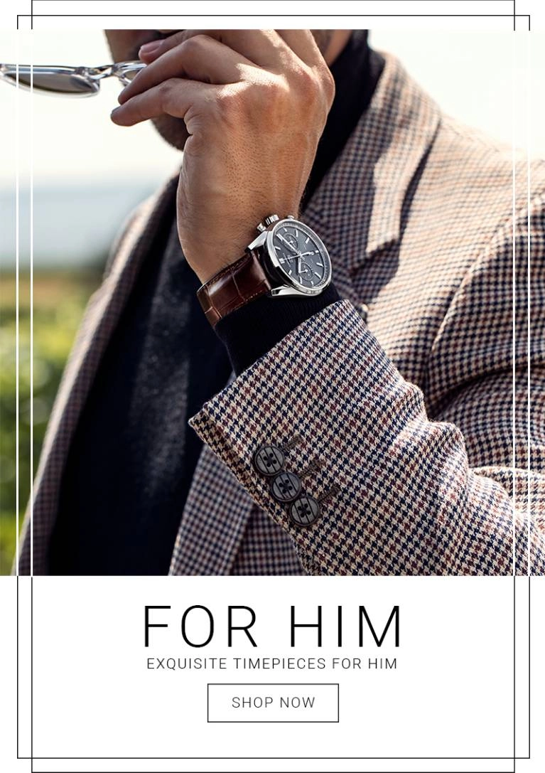 A man in a suit modelling a watch