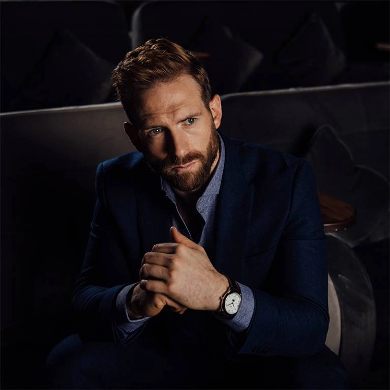An image of a Longines watch on a model
