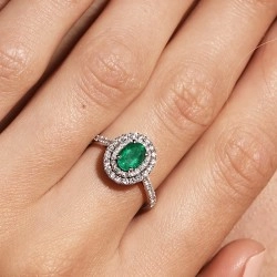 18ct White Gold Oval Emerald & Diamond Double Halo Style Ring on model