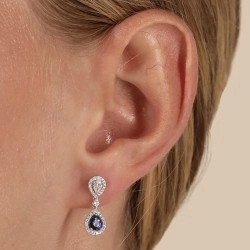 18ct White Gold Pear Shaped Sapphire & Diamond Cluster Earring on a model