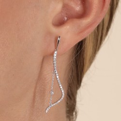 18ct White Gold Long Diamond Wave Drop Earring on a model