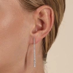 18ct White Gold Tapered Diamond Drop Earring on a model