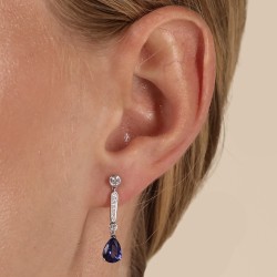 18ct White Gold Pear Cut Tanzanite & Diamond Drop Earrings on a model