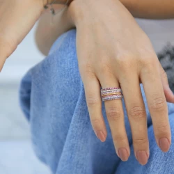 Different coloured stacking rings shown on a female hand