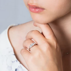 Florentine Platinum and Princess Cut Diamond Three Stone Ring on models hand