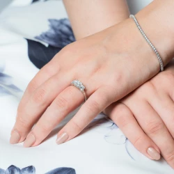 Florentine Platinum and Princess Cut Diamond Three Stone Ring paired with a diamond set tennis bracelet