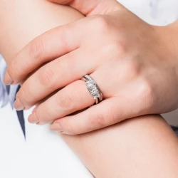 Florentine Platinum and Princess Cut Diamond Three Stone Ring paired with a diamond set wedding band