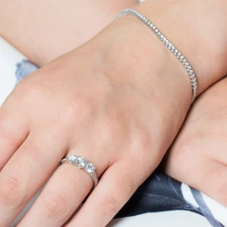 Memoire Platinum & Diamond Three Stone Engagement Ring paired with a diamond tennis bracelet