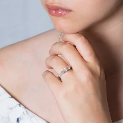 Memoire Platinum & Diamond Three Stone Engagement Ring on models hand