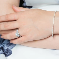 Skye Brava Platinum and Diamond Cushion Shaped Cluster Ring paired with diamond set wedding ring