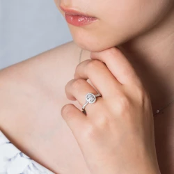 Skye Platinum and Oval Diamond Cluster Engagement Ring on models hand