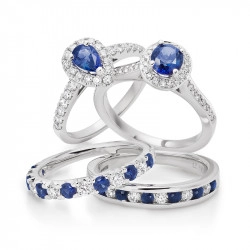 Two sapphire and diamond cluster rings above two sapphire and diamond set wedding bands