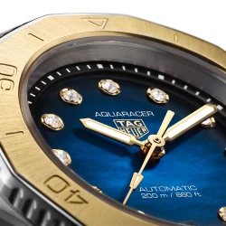 TAG Heuer Aquaracer Professional 200 Smokey blue diamond dot dial and gold bezel close up