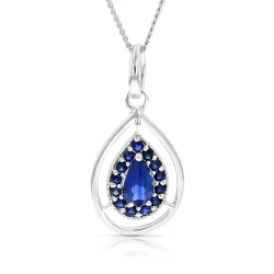 Teardrop shaped sapphire surrounded by smaller round sapphires set in 9ct white gold