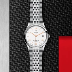 Tudor 1926 36mm white dial stainless steel watch on black and red background